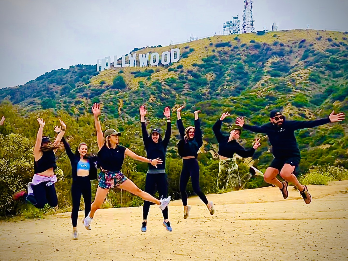 group of friends talking the hollywood sign walking tour