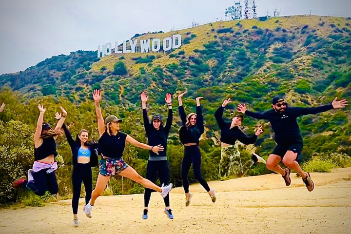 group of friends talking the hollywood sign walking tour