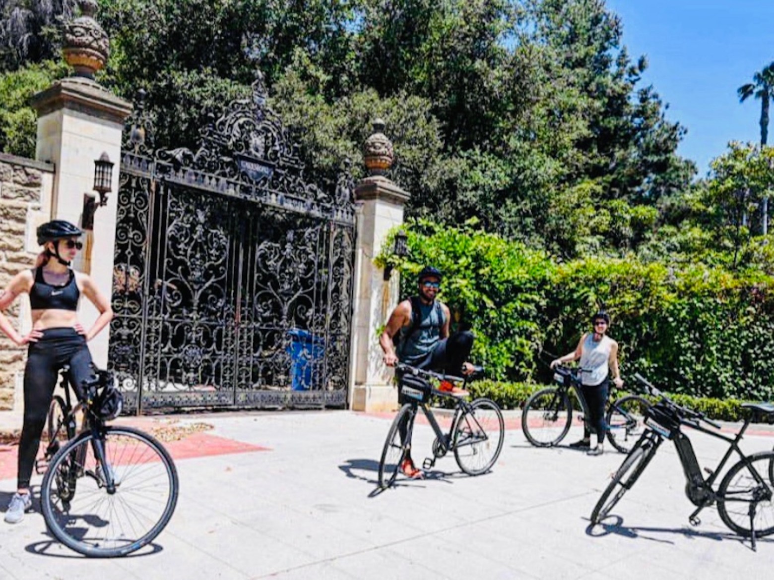 group of people outside celebrity home on Beverly Hills tour