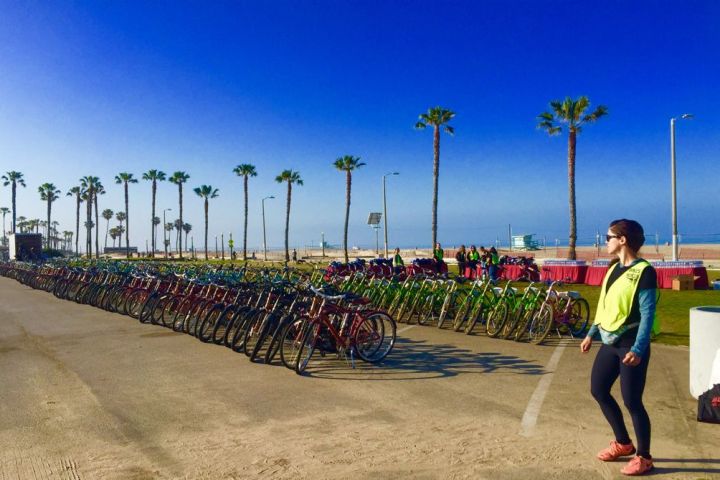 a group of people standing in a parking lot