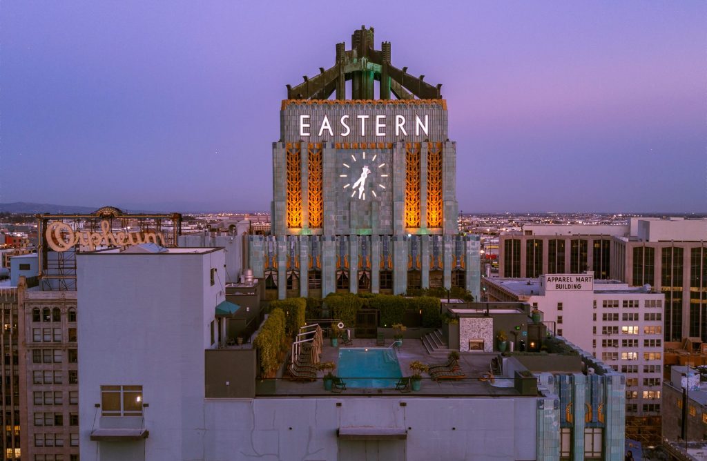 a large clock tower towering over a city