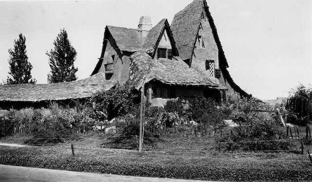 a house with trees in the background