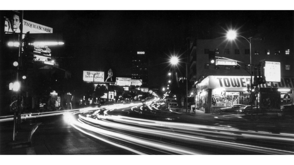 a blurry photo of a city street at night