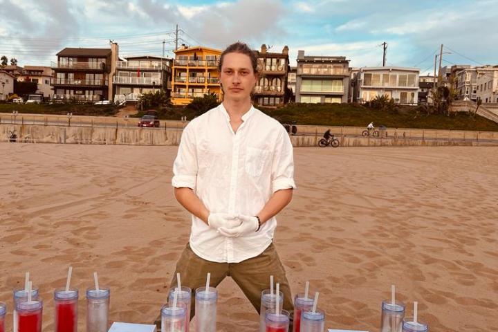 a man standing in front of a table