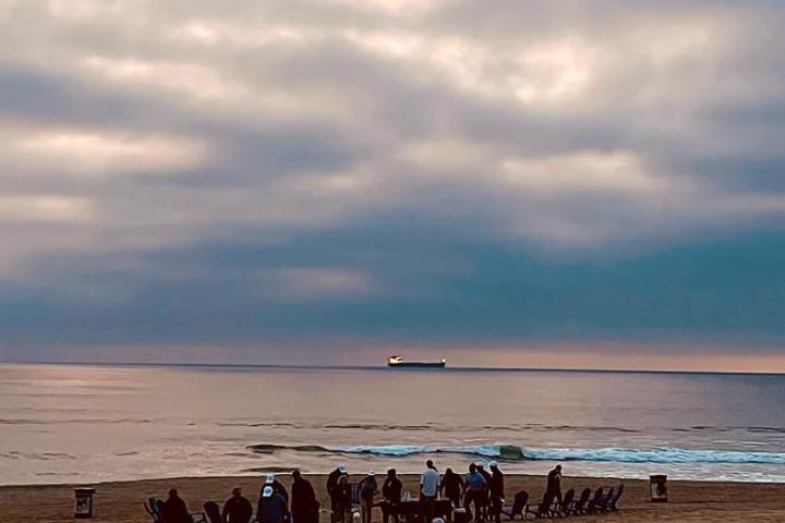 a group of people on a beach