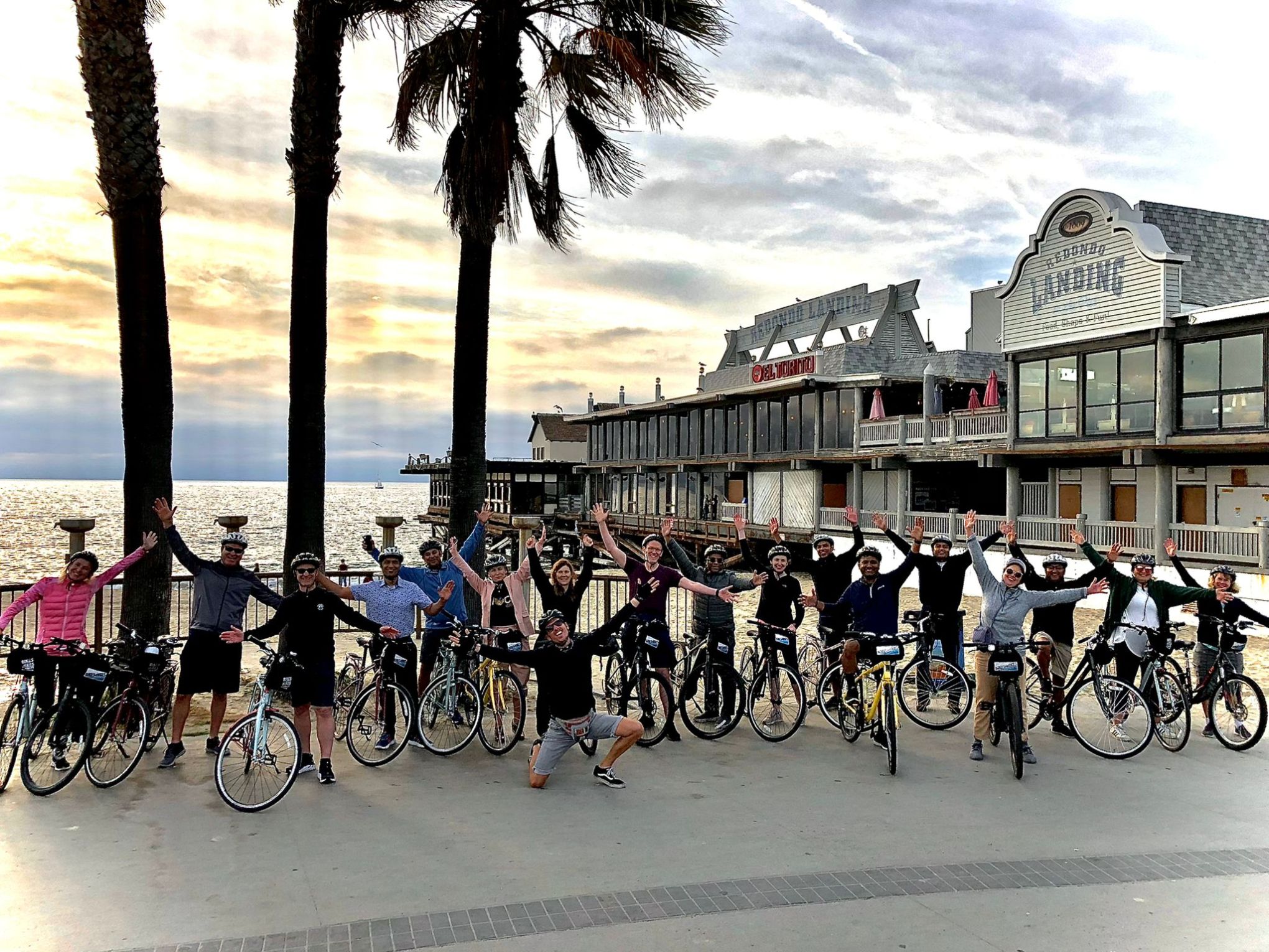 a group of people on bikes by the ocean