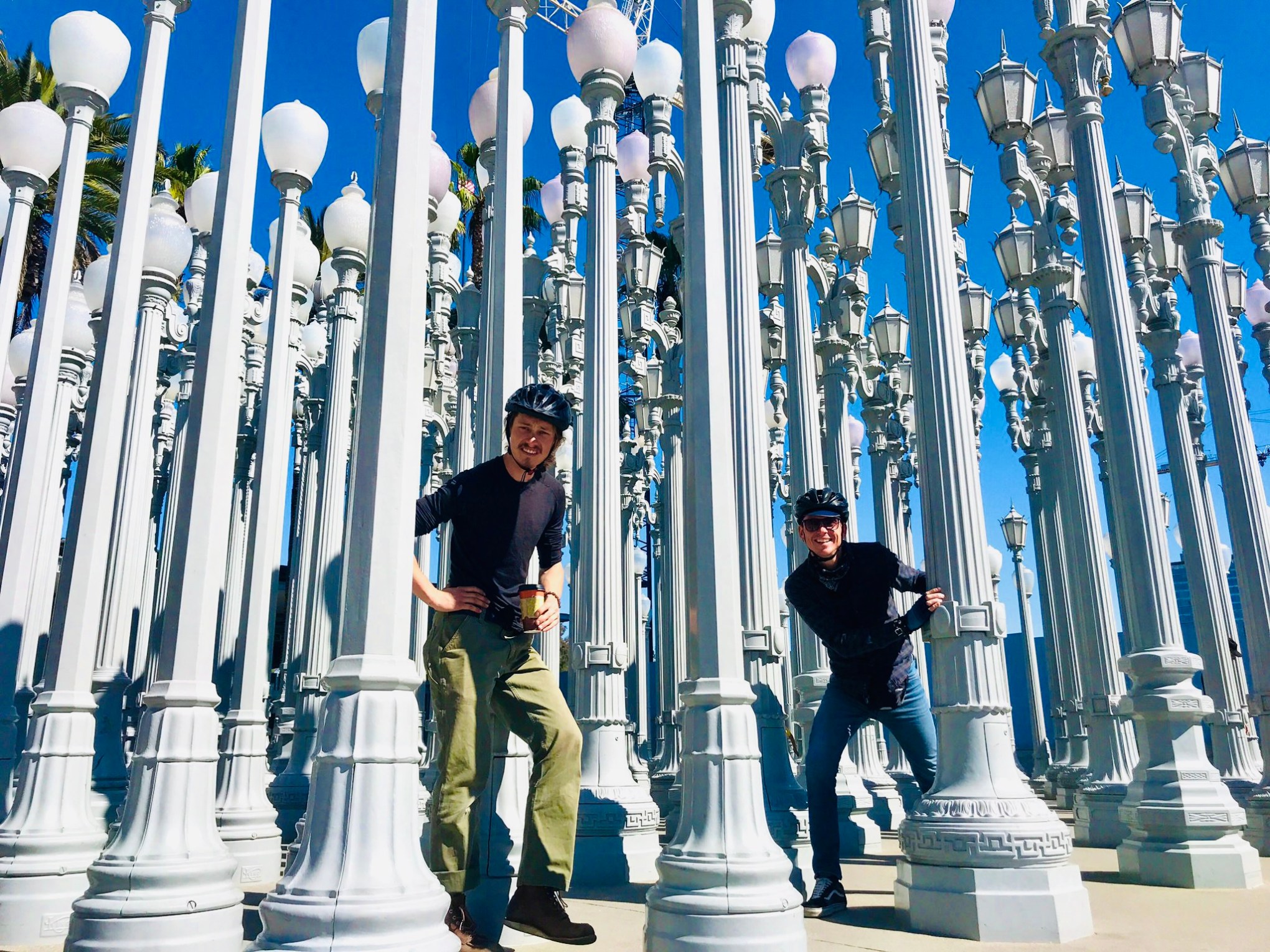a group of people standing in front of the lights at LACMA