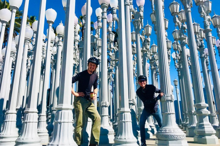 a group of people standing in front of the lights at LACMA