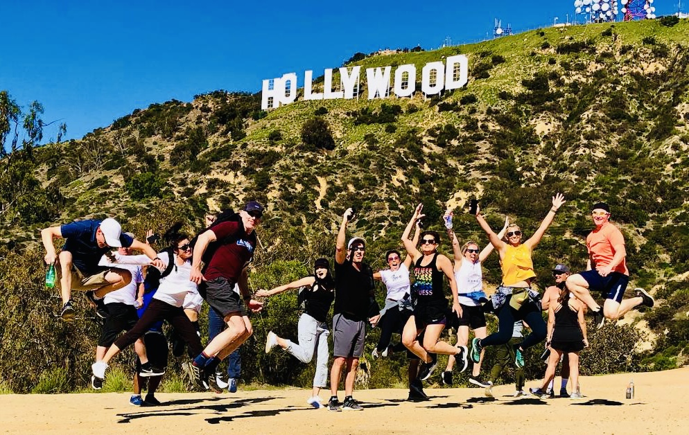 a group of people playing a game of frisbee