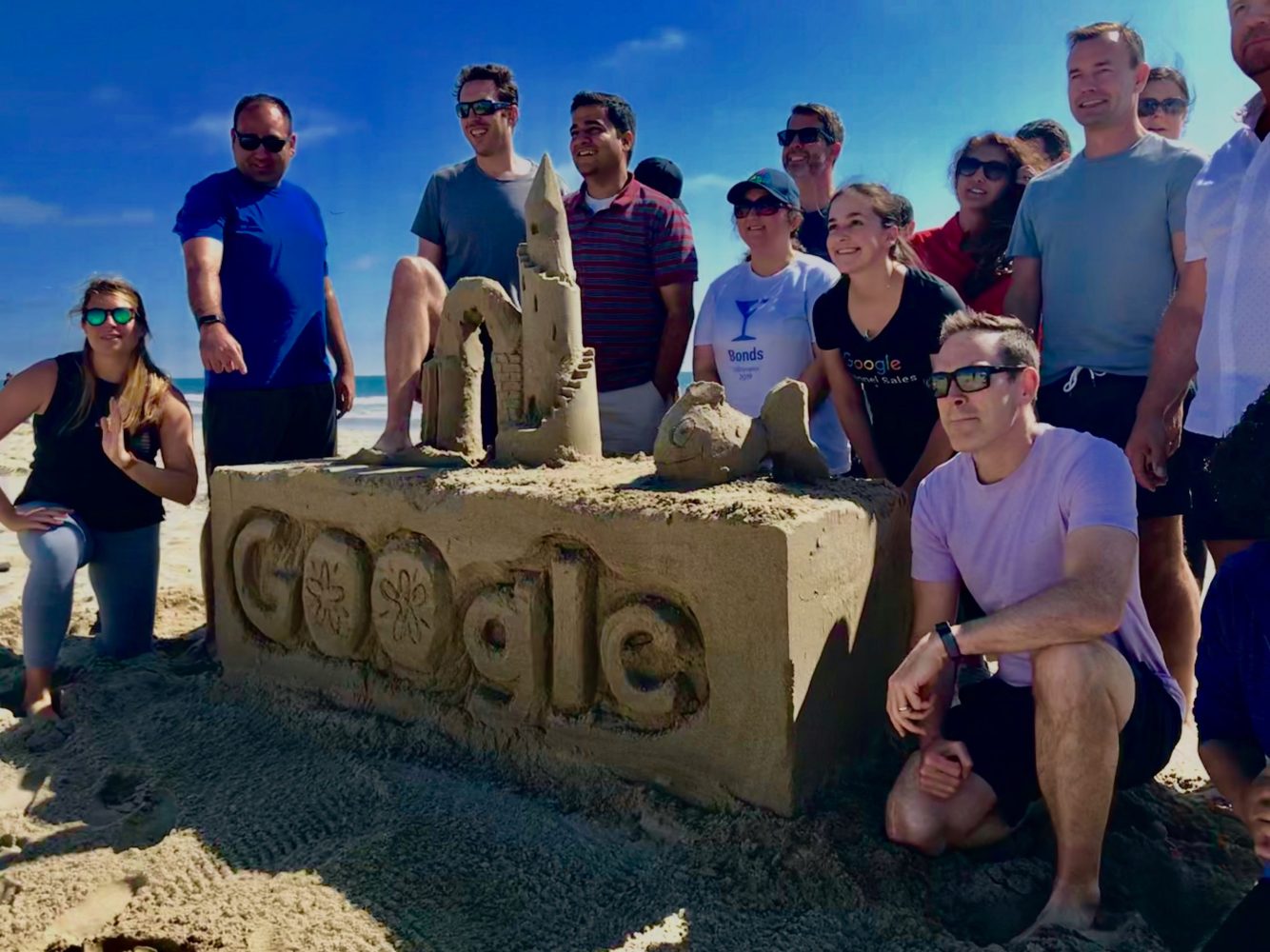 a group of people standing next to a bicycle