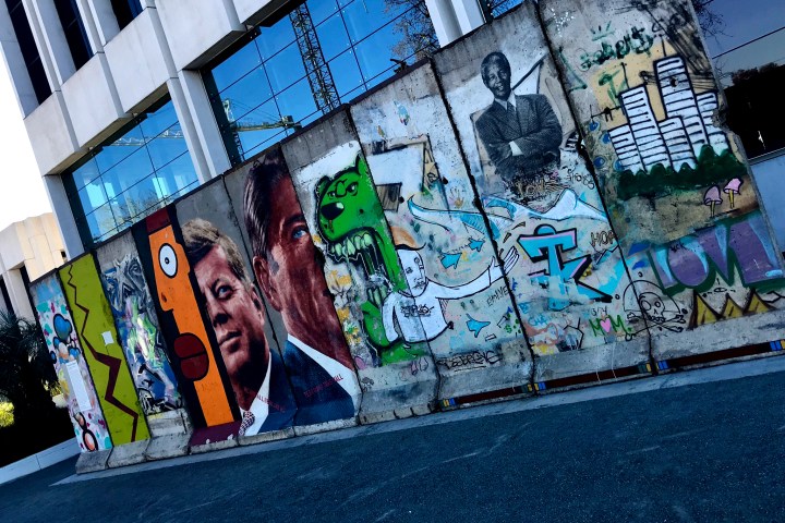 a graffiti covered building in downtown la, available on an la tour