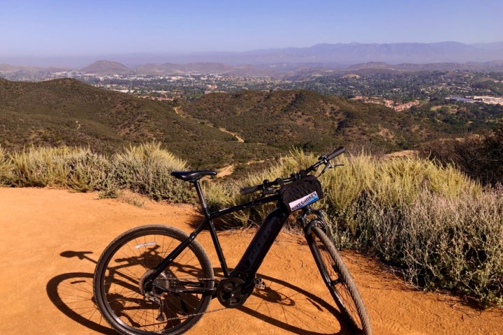 a bicycle parked on the side of a mountain on a tour of westlake