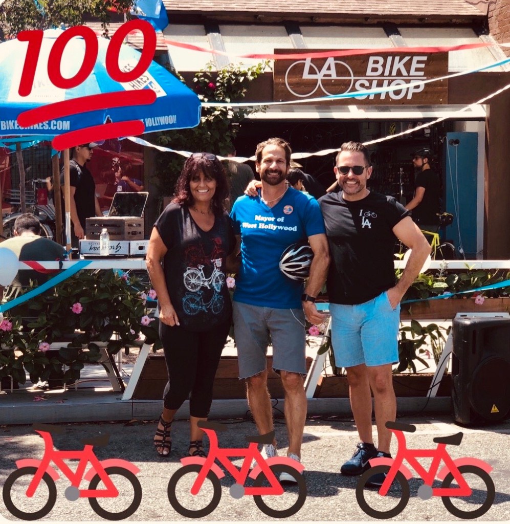 a group of people standing in front of a sign