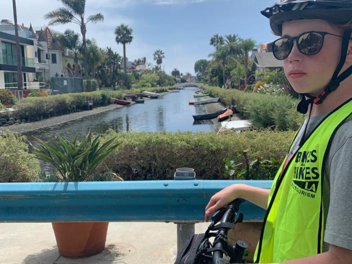 a person riding on the back of a bicycle