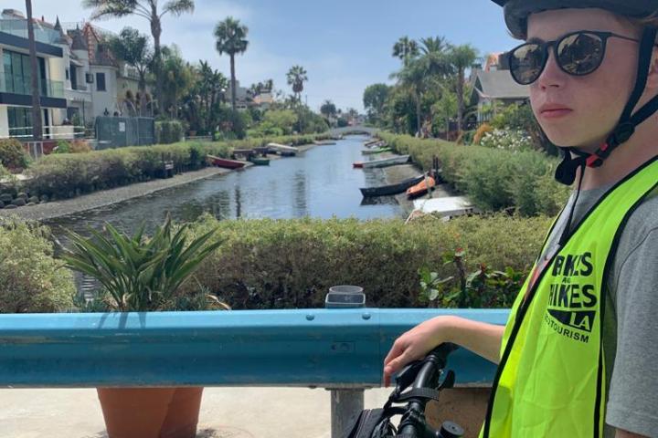 a person riding on the back of a bicycle