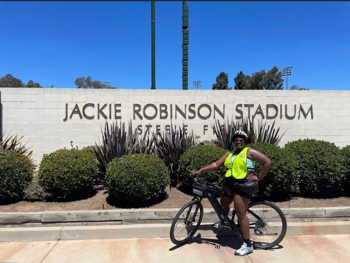 a man riding on the back of a bicycle