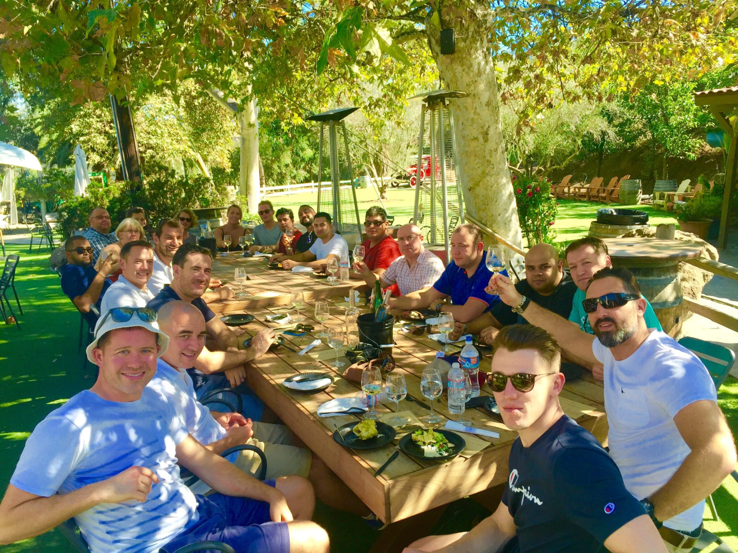 Chad Hundley et al. sitting at a table eating food