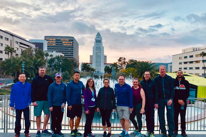 a group of people standing in front of a building