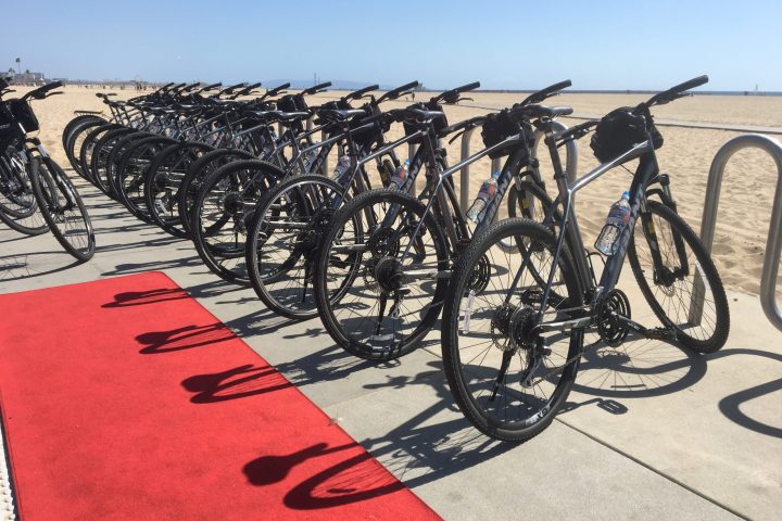a bicycle parked on a beach