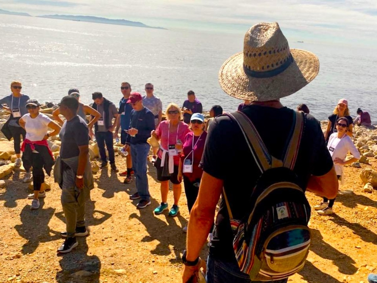 a group of people on a beach