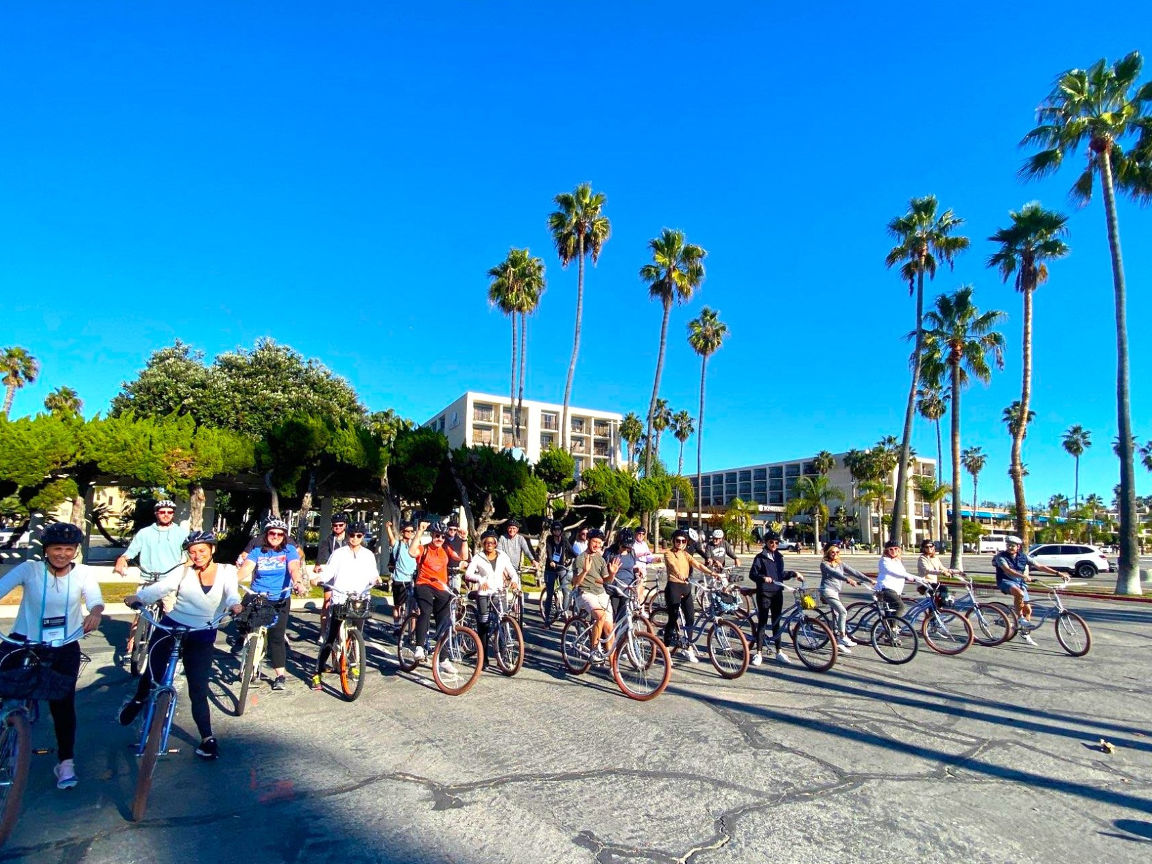 a group of people riding bikes down a street