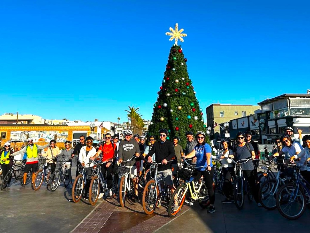 a group of people riding on the back of a motorcycle
