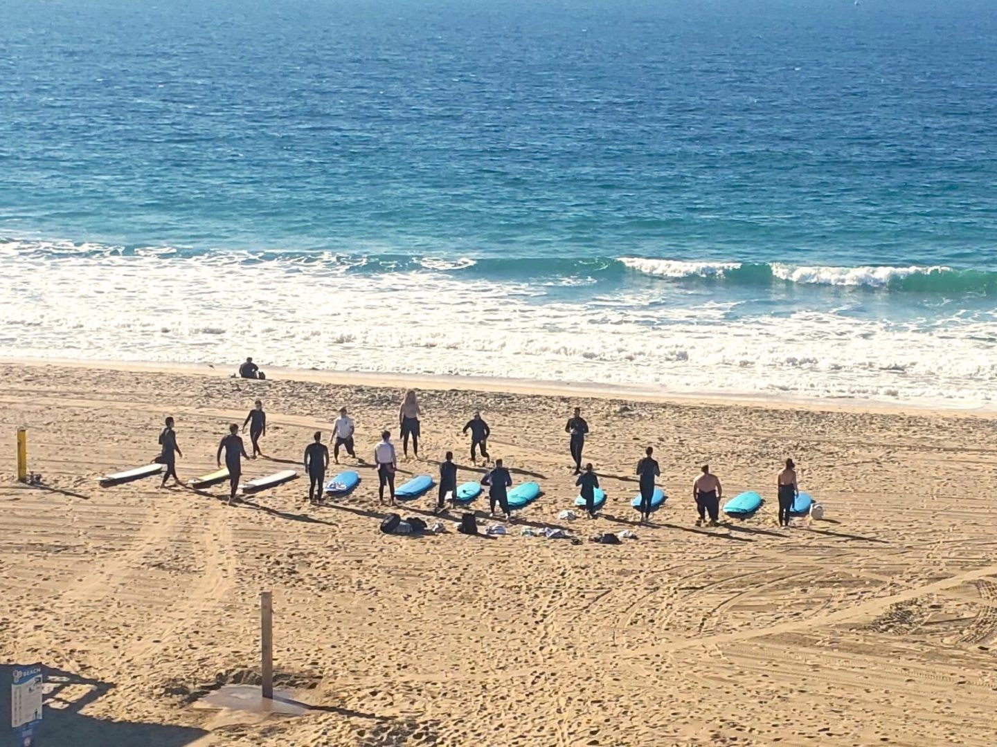 a group of people sitting at a beach