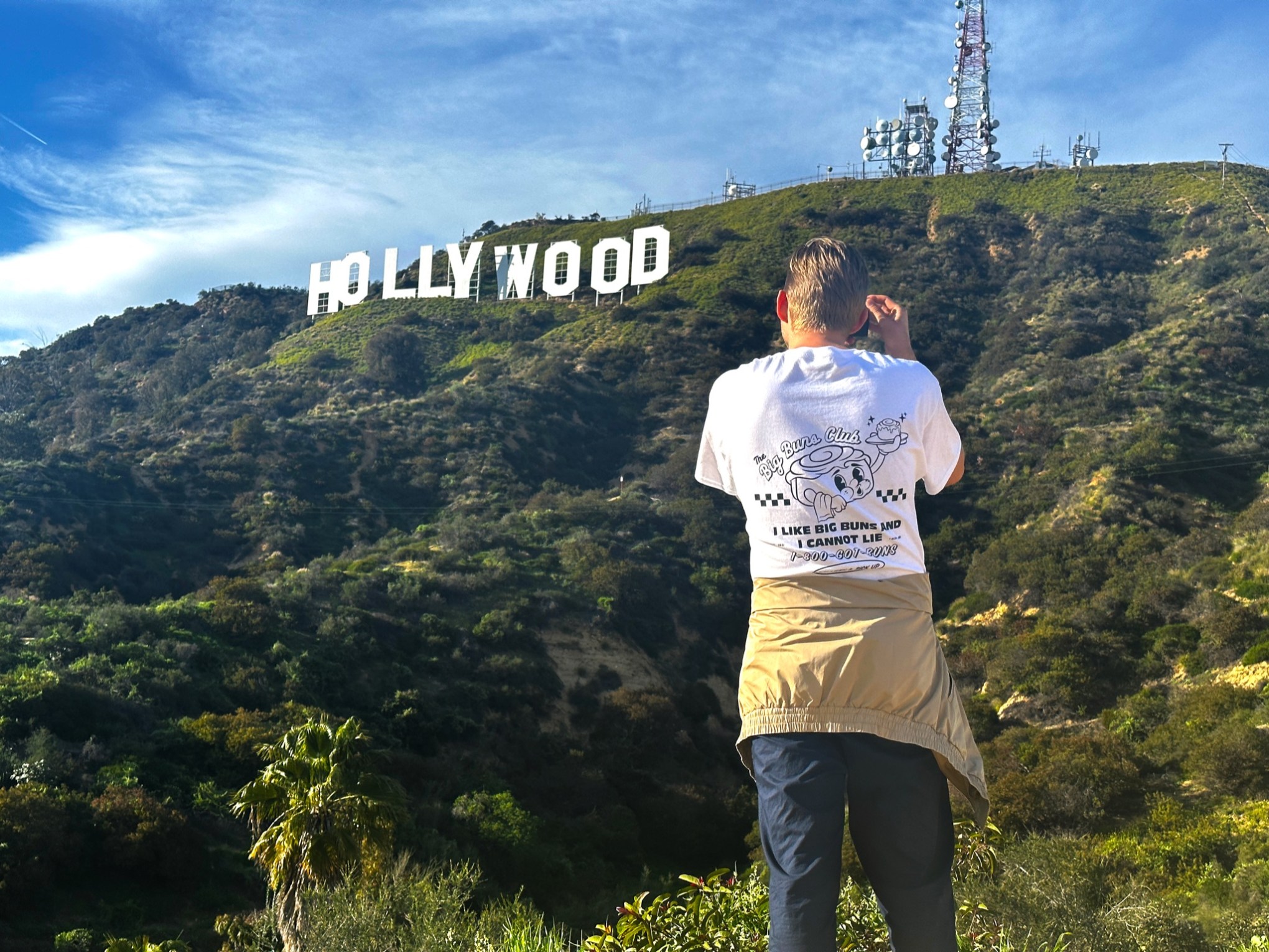 taking a photo of the hollywood sign