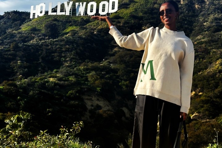 a man standing in front of a mountain