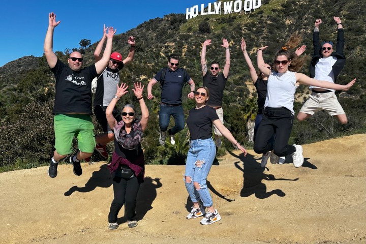 group jumping in front of hollywood sign
