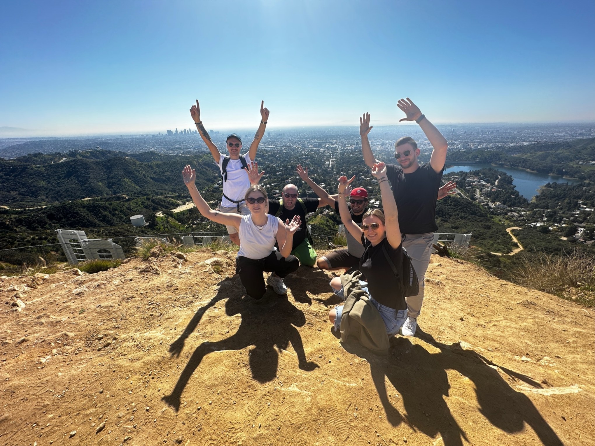 a man flying through the air while riding a bike down a dirt road