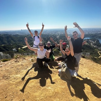 a man flying through the air while riding a bike down a dirt road