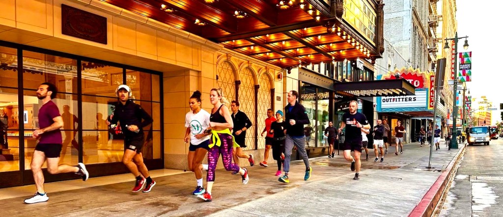 a group of people standing in front of a building