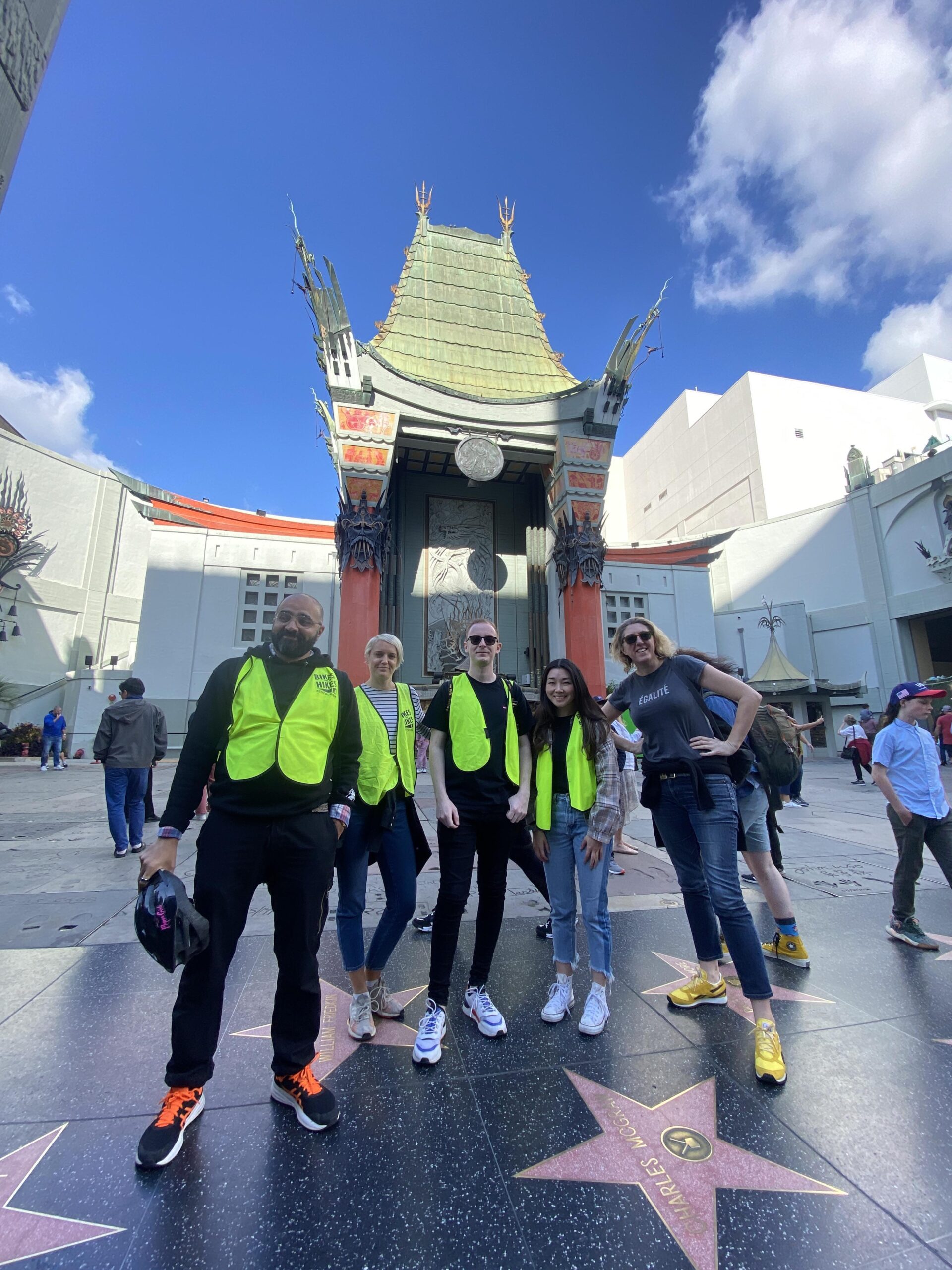 a group of people standing in front of a building