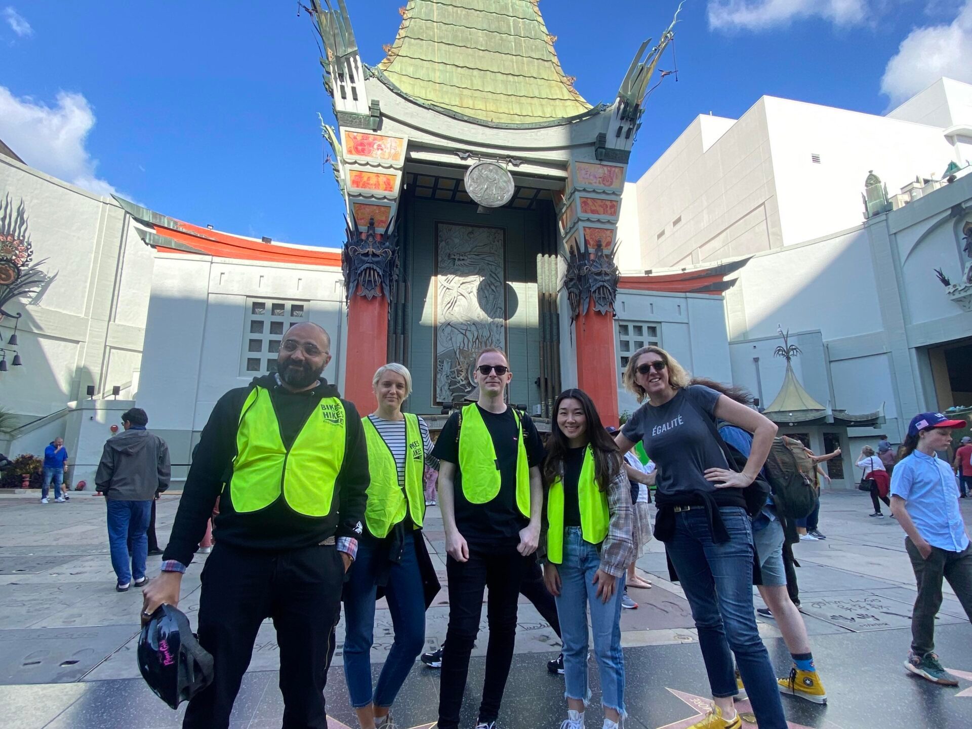 a group of people standing in front of a building