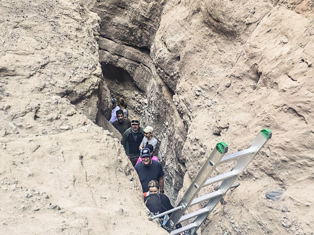 a man lying on a rock