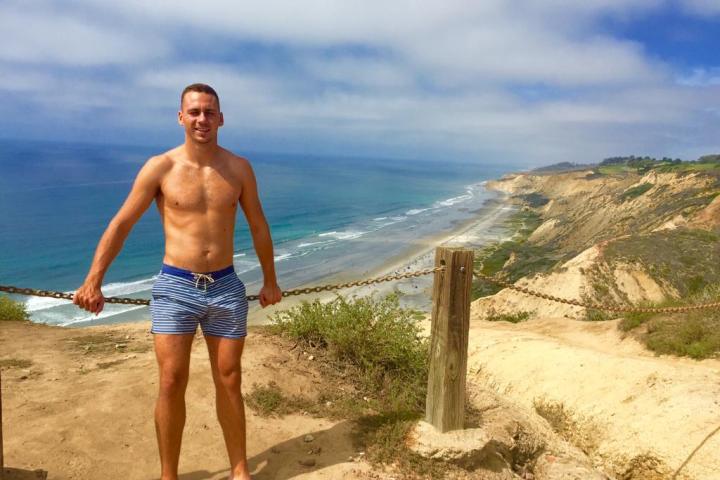 a person standing on a beach in san diego