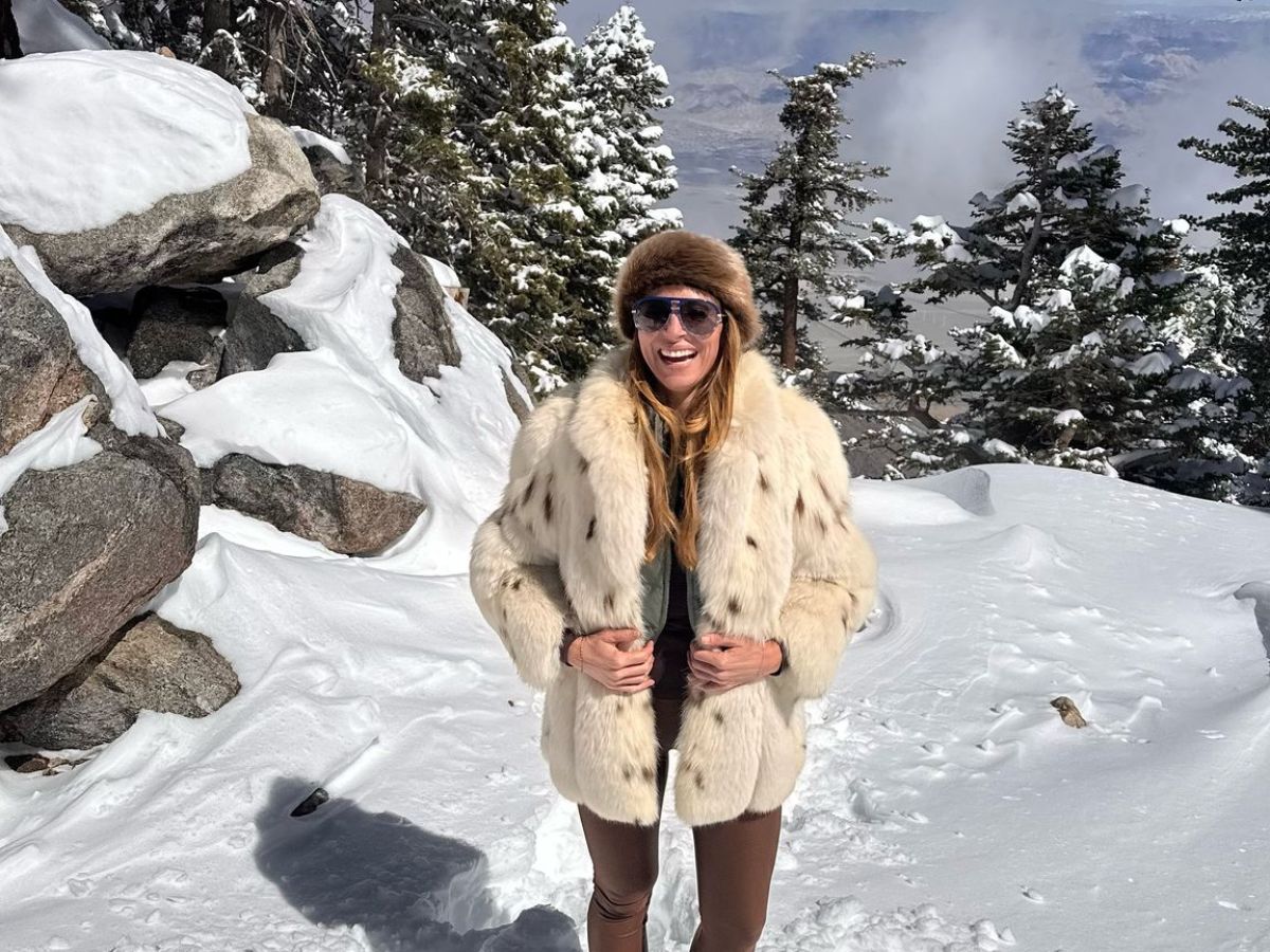 a person standing on a snow covered slope