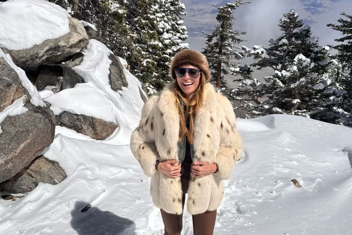 a person standing on a snow covered slope