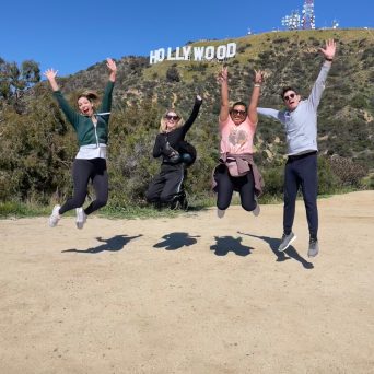 a group of people flying kites on a beach