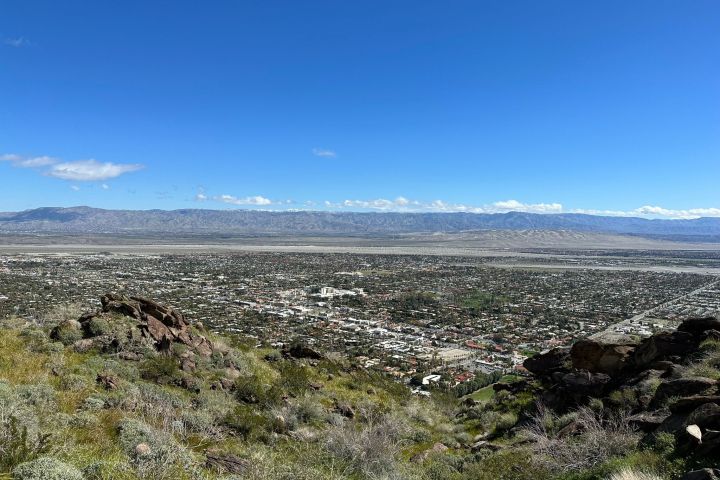 a scenic overlook of downtown palm springs on a group hike tour