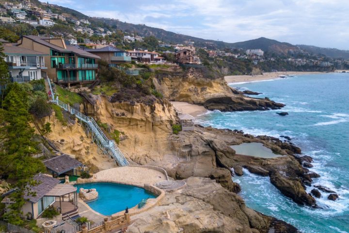 a body of water with a mountain in the background