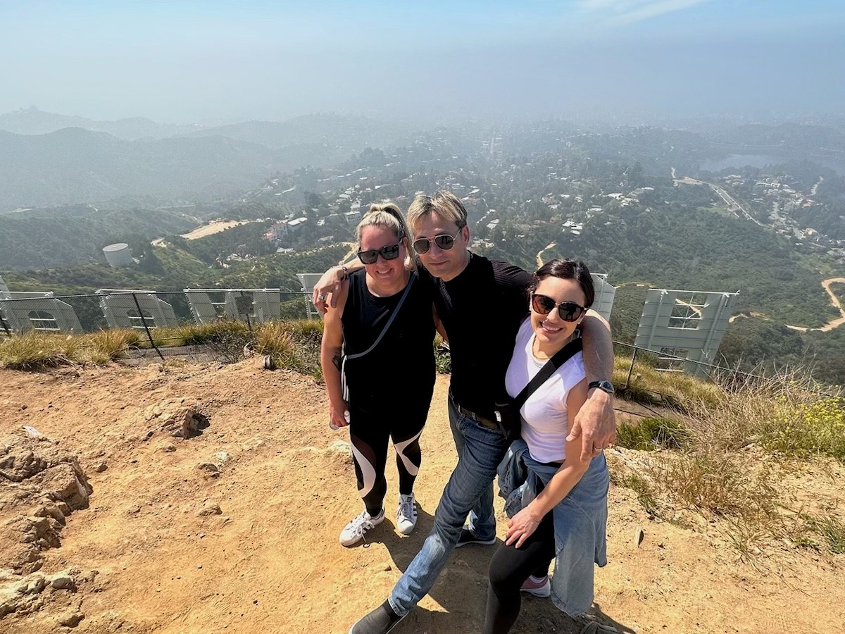 a man riding a bike down a dirt road