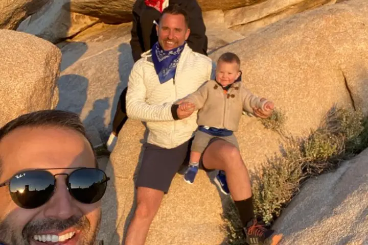 a group of people hiking through joshua tree on our joshua tree hike tour