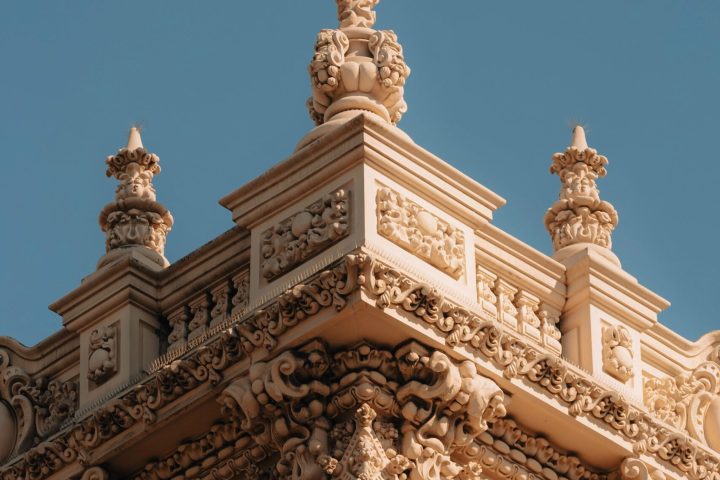 a large clock tower in front of a building