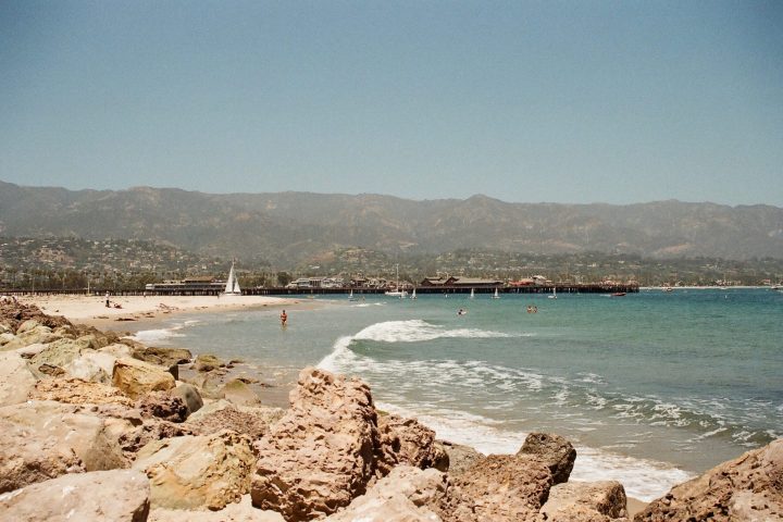 a rocky beach next to the ocean