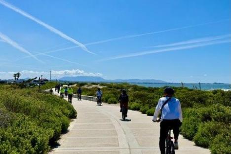 a group of people riding bikes on a road on an ojai group bike tour