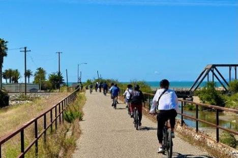 a group of people walking down a path on an ojai group tour