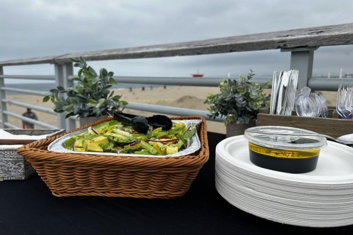 a bowl of food on a table overlooking the beach on a bikes and bites tour