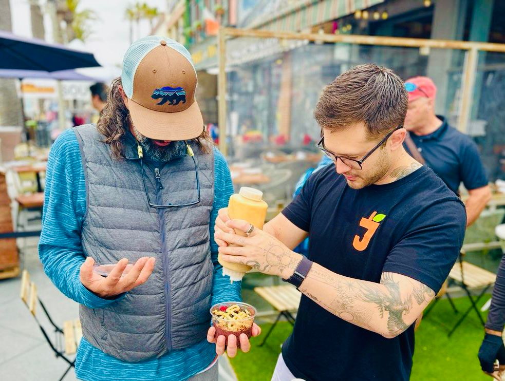 a group of people looking eating on a bikes and bites food tour